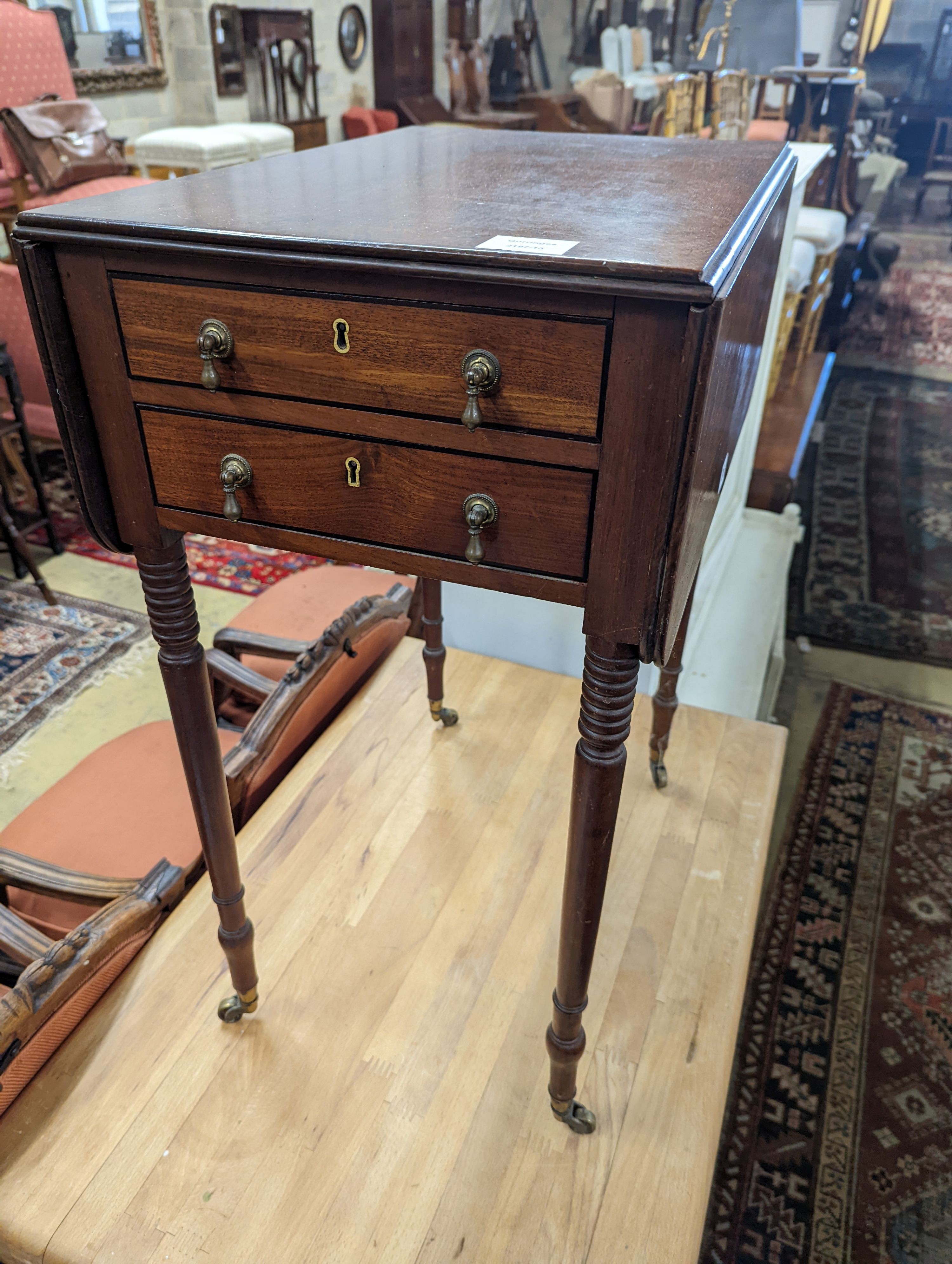 A Regency mahogany drop flap work table, the drawers with brass pear drop handles, width 37cm, depth 53cm, height 73cm